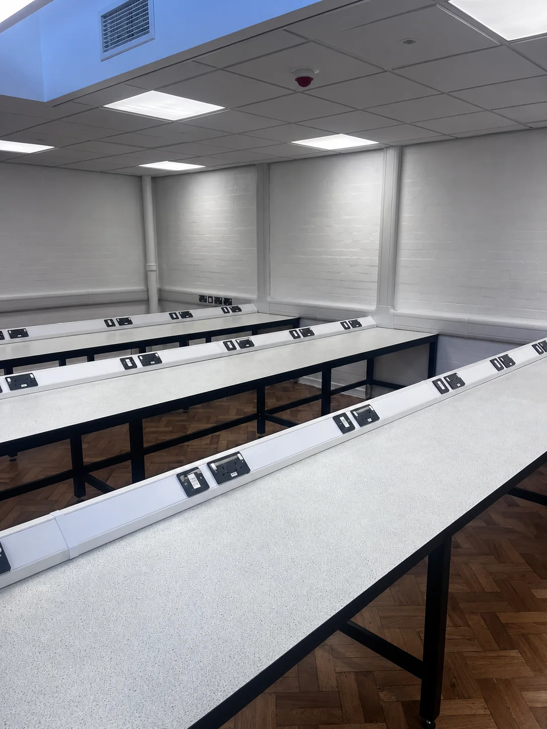 Electrical outlets installed along laboratory benches